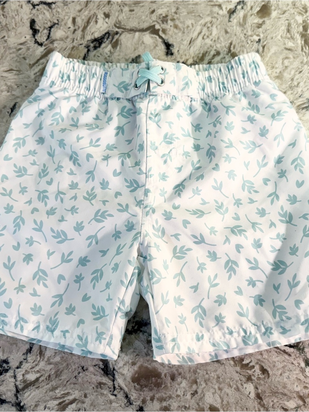 Ruffle Butts White Swim Trunks with Mint Botanical Print